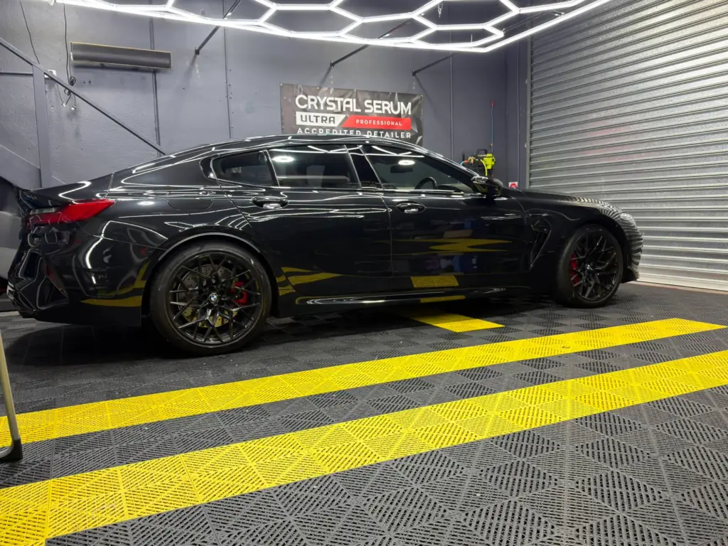 Black BMW M8 Gran Coupe with paint protection film at our Keysborough workshop